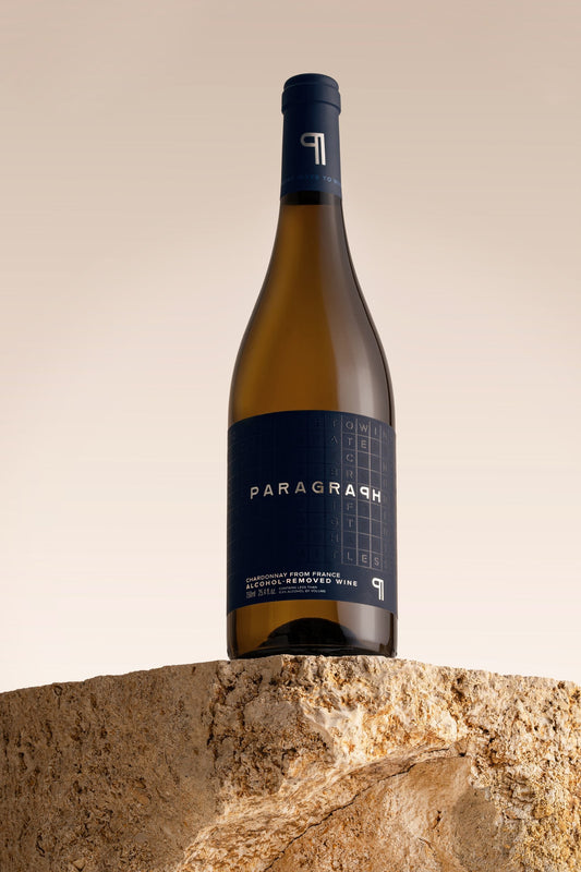 PARAGRAPH Chardonnay bottle standing on a stone block